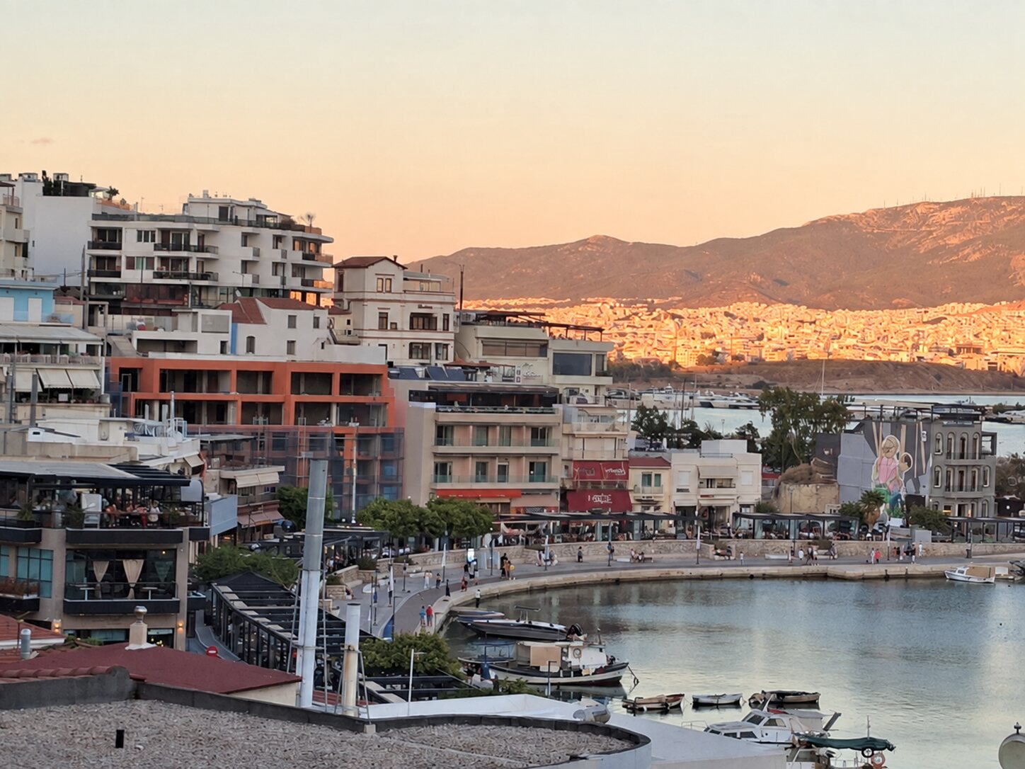 Kastella rooftops and the harbour at sunset